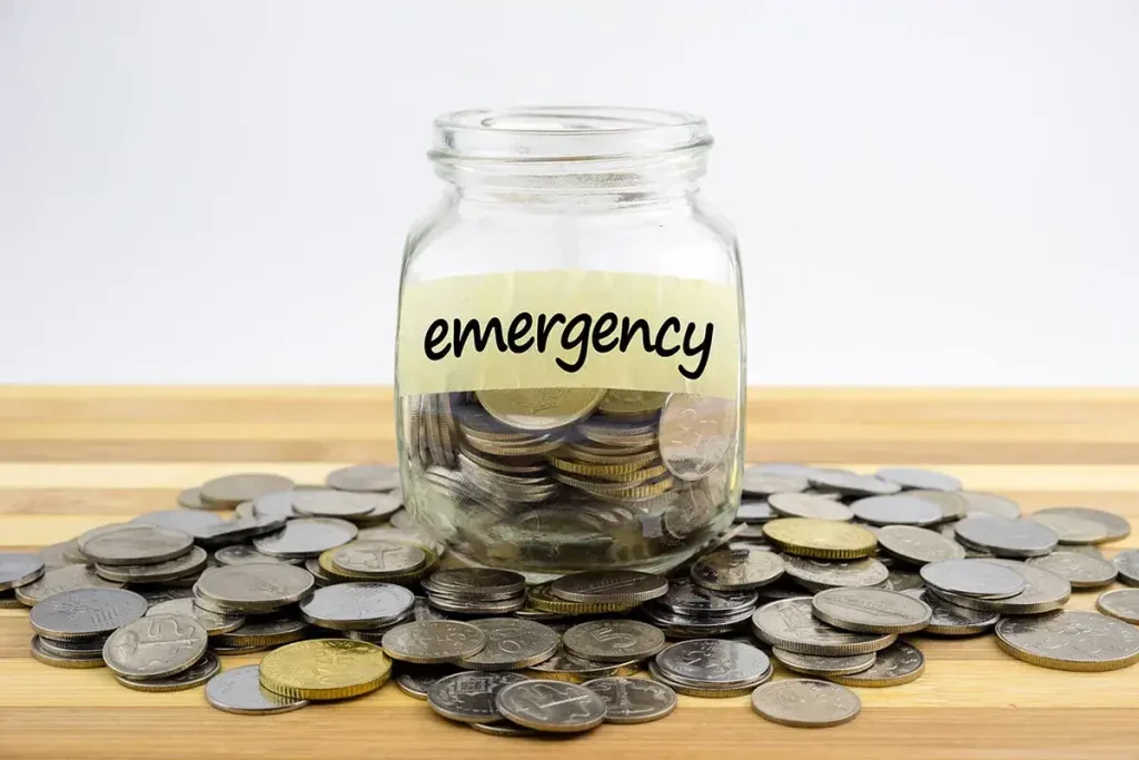 Jar of coins labeled emergency.