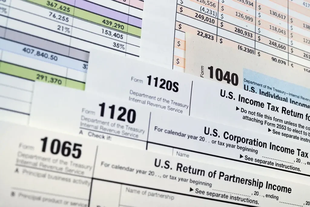 Tax documents staggered on top of each other.